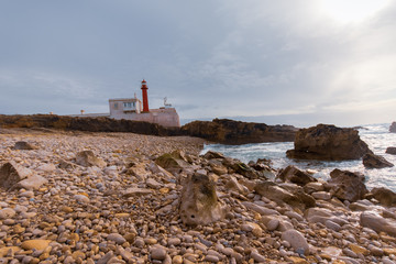 Fototapeta na wymiar Amazing lighthouse in the Portuguese coastline. Cascais Portugal