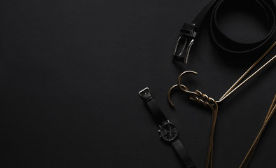 Objects luxury flatlay on black background. Men accessories and beauty equipment. Minimalist black trendy 2020.