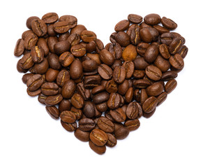 Roasted coffee beans in the shape of the heart isolated on white background with clipping path