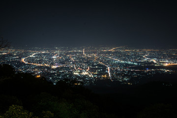 Night city scape at top view point of Chiang Mai, Thailand.