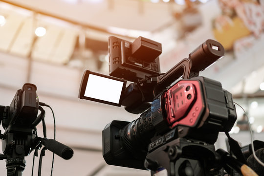 Media Television film Production and interview reporter concept: Video recorder movie recording films shooting of grand opening in conference hall live event streaming for presentation by videographer