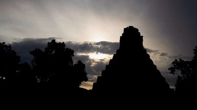 Guatemala: Tikal National Park, Time Lapse at Sunrise with Great Jaguar Temple in Silhouette