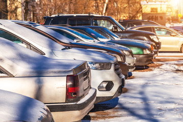 Parked used cars in the winter