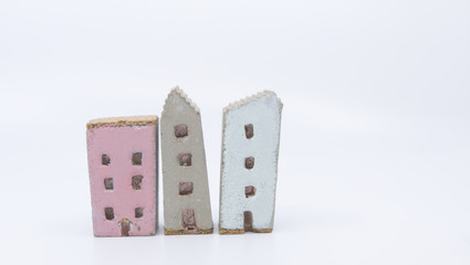 3 model  homes on a white background
