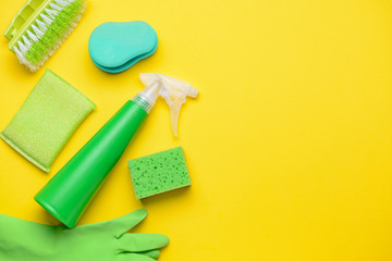 Set of cleaning supplies on color background