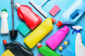 Set of cleaning supplies on color background