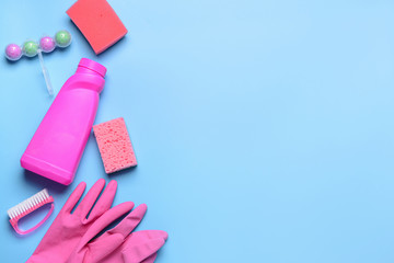 Set of cleaning supplies on color background
