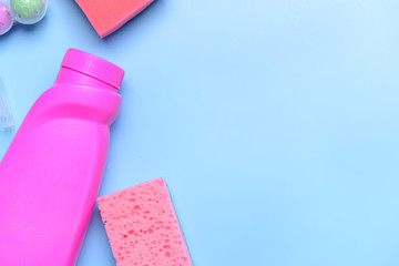 Set of cleaning supplies on color background