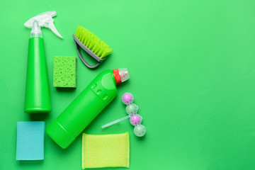 Set of cleaning supplies on color background