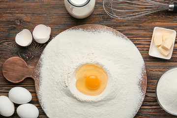 Ingredients for preparing bakery on wooden table