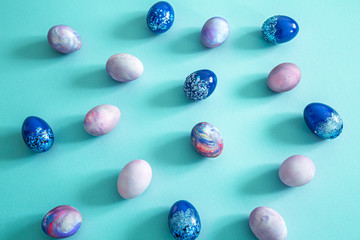 Easter colored eggs on a colored background.