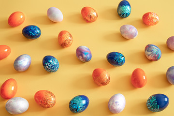 Easter colored eggs on a colored background.