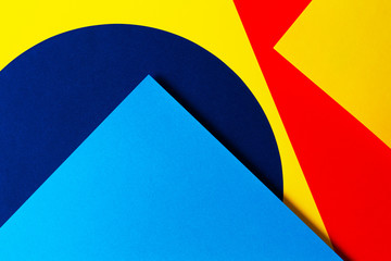 Abstract colored paper texture background. Minimal geometric shapes and lines in light blue, navy, red and yellow colors