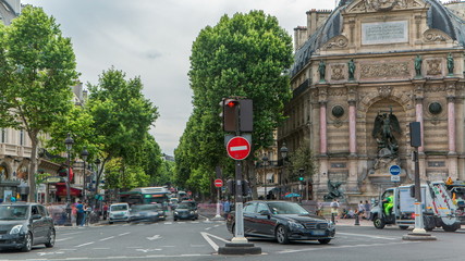 Street view of Place Saint-Michel with ancient fountain timelapse, Paris