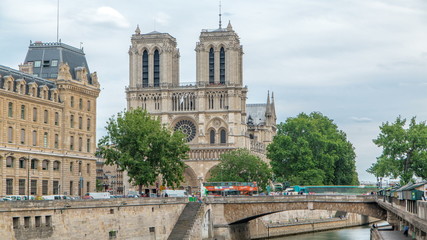 Obraz premium Notre Dame de Paris and Seine timelapse is the one of the most famous symbols of Paris