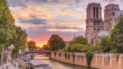Fototapeta na wymiar Sunset view of Cathedral Notre Dame de Paris timelapse in Paris, France.
