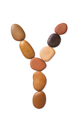 Letter Y made of marine small pebbles. Alphabet made of stones Isolated on a white background
