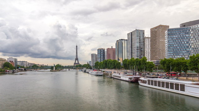 The Statue of Liberty and the Eiffel Tower Timelapse  with modern buildings. Paris, France