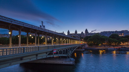 View of pont de Bir-Hakeim day to night timelapse - a bridge that crosses the Seine River. Paris, France