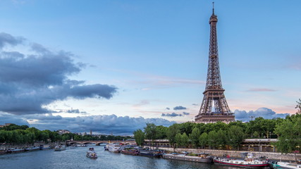 The Eiffel Tower day to night Timelapse with boat station. Paris, France