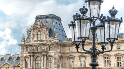 Side gallery entrance, streetlamp and architecture of the famous Louvre museum and gallery timelapse, Paris, France