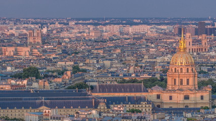 Fototapeta na wymiar Aerial view of a large city skyline at sunset timelapse. Top view from the Eiffel tower. Paris, France.