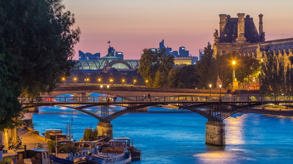 Fototapeta na wymiar View on Pont des Arts in Paris after sunset day to night timelapse, France