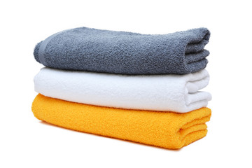 Pile of clean towels isolated on white background