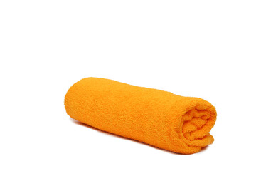 Yellow rolled spa towel isolated on white background with copyspace