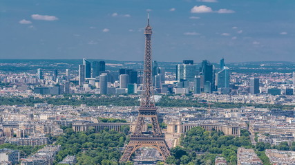 Aerial view from Montparnasse tower with Eiffel tower and La Defense district on background timelapse in Paris, France.