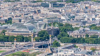 Fototapeta premium Top view of Paris skyline from observation deck of Montparnasse tower timelapse. Main landmarks of european megapolis. Paris, France