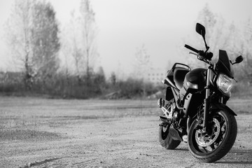 Fototapeta na wymiar Black sports motorcycle close-up on the street.