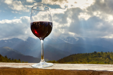 glass of wine in mountains