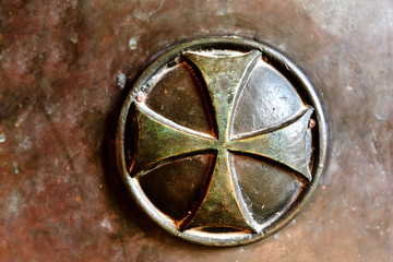 metal cross in the door