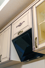 A stainless steel hob on a marble countertop, kitchen set