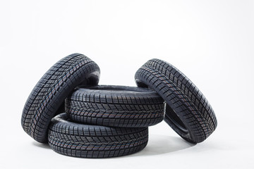 four black tires isolated on white background