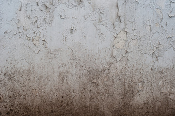 texture of a shabby wall. stone texture. old dirty wall with scratches and cracks and peeling paint