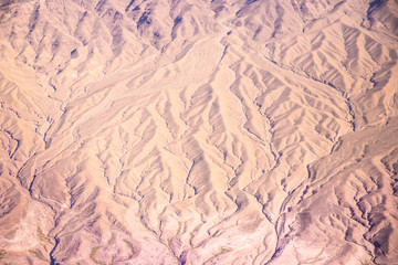 Aerial Photography over western United States with landforms, desert and mountains in view