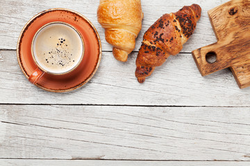Breakfast with coffee and croissant