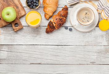 Breakfast with coffee and croissant