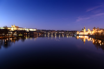 Fototapeta na wymiar panoramic view To Hradschin Castle, St. Vitus Cathedral And Charles Bridge In Prague, Czech Republic during sunset with dramatic sky