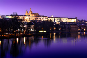 Fototapeta premium panoramic view To Hradschin Castle, St. Vitus Cathedral And Charles Bridge In Prague, Czech Republic during sunset with dramatic sky