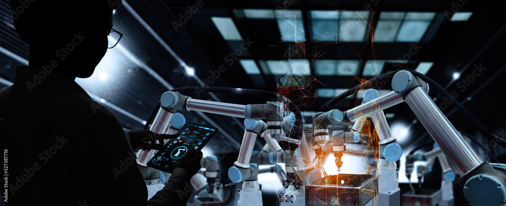 Poster Factory Female Industrial Engineer working with automation robot arms machine in intelligent factory industrial on real time monitoring system software.Digital future manufacture.