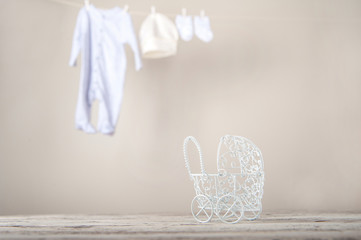 Baby clothes on a rope dry. Laundry of children's things. The concept of washing things and copy space.