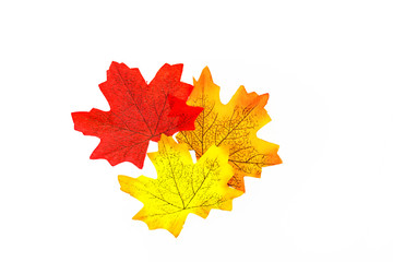 plastic artificial  maple leaf made from fabric isolated on white background