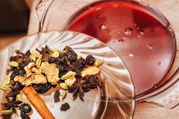 the process of making mulled wine at home in the kitchen. example of how a hot drink is prepared