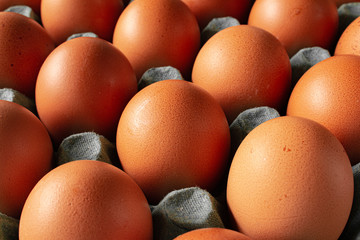 Closeup of a basket with eggs. Red chicken eggs. Food of animal origin. Not suitable for vegans.
