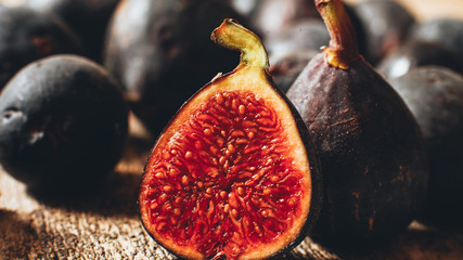 Fall harvest. Healthy organic fruit. Juicy ripe fig on wooden background.