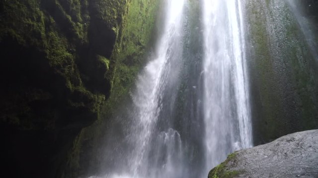 Powerful waterfall Gljufrabui in the cave, slow motion, Iceland