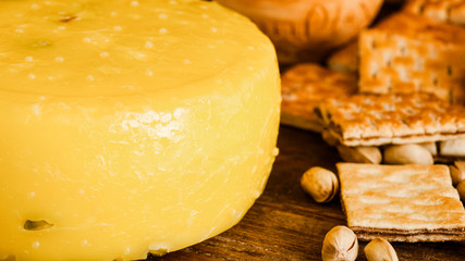Organic snacks. Food composition. Homemade cheese wheel cookies pistachio nuts.